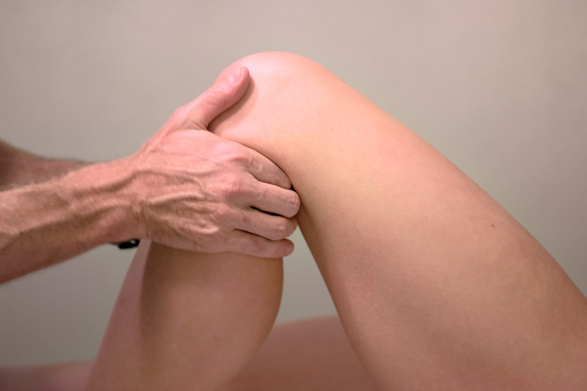 Joe Uhan performing physical therapy for hip and knee alignment